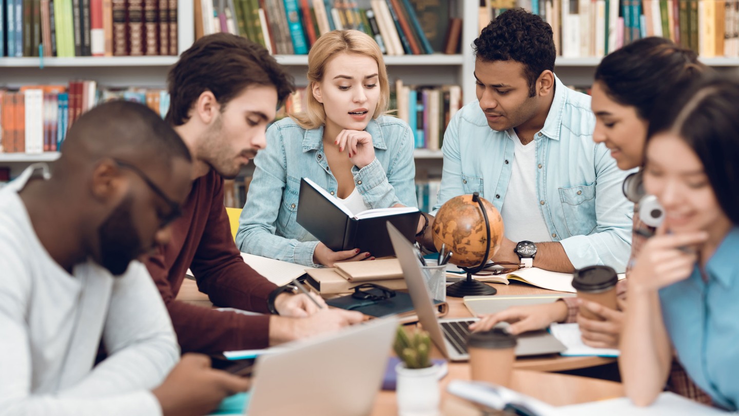 Students studying around a table.